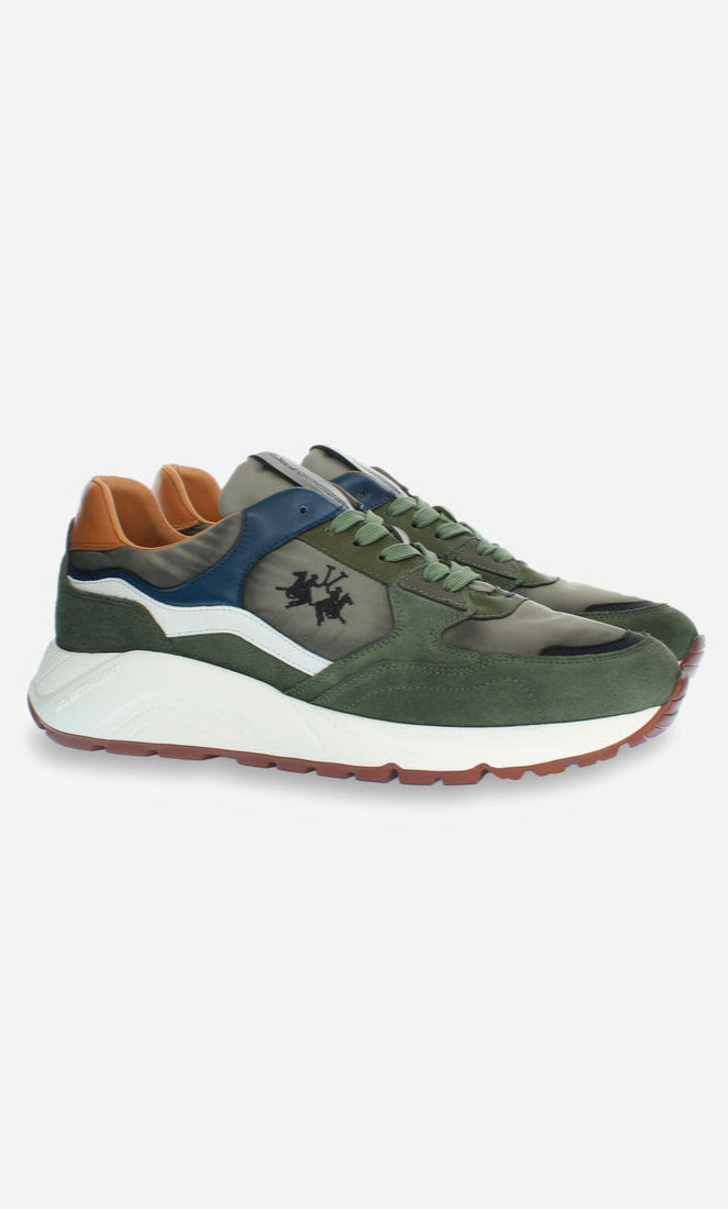 Green sneakers with brown and blue accents on a white background