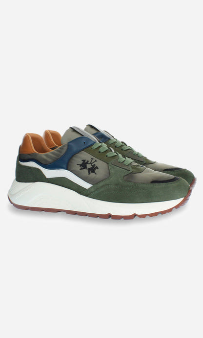 Green sneakers with brown and blue accents on a white background