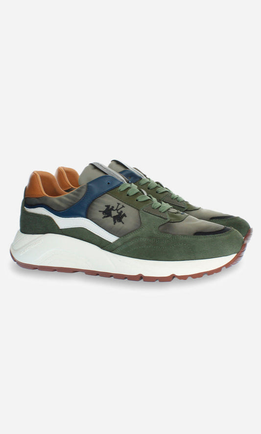 Green sneakers with brown and blue accents on a white background